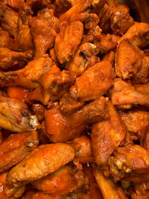 A tray of buffalo chicken wings