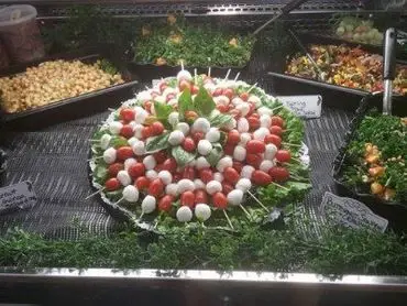 A caprese platter with fresh mozzarella, tomato and basil