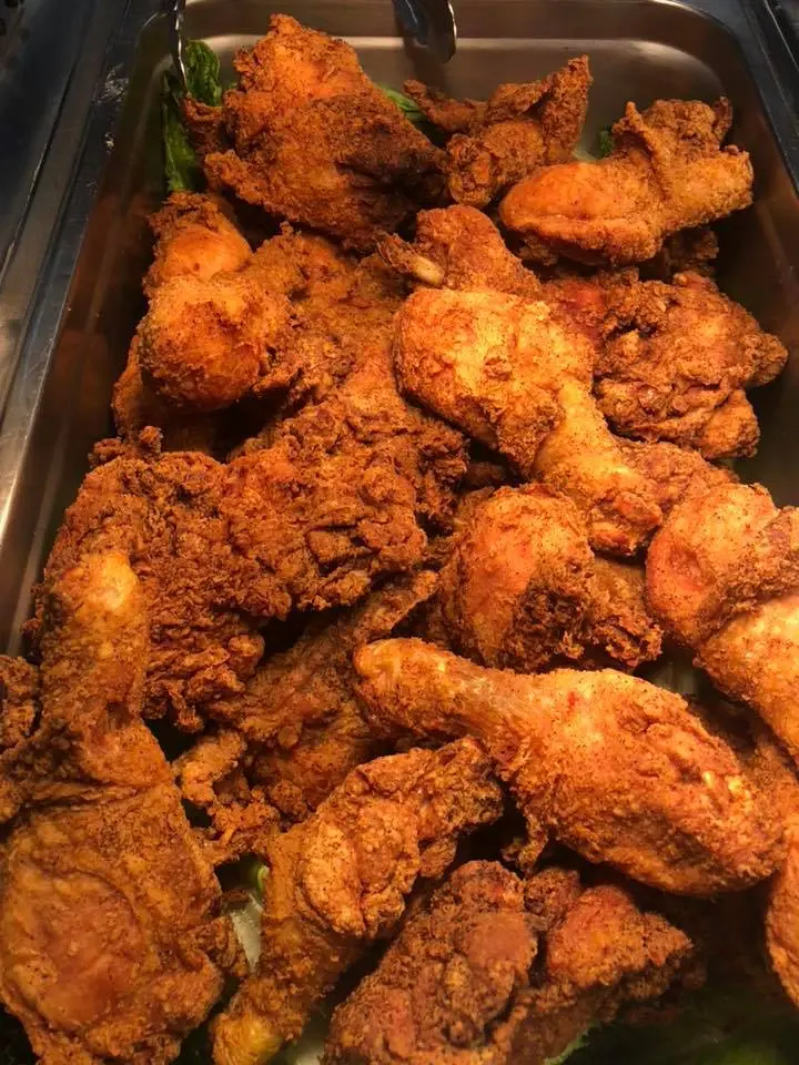 A catering tray of fried chicken