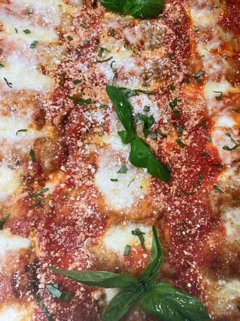 A catering tray of baked lasagna