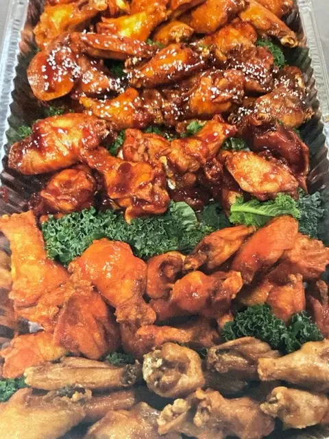 A catering tray of mixed chicken wings