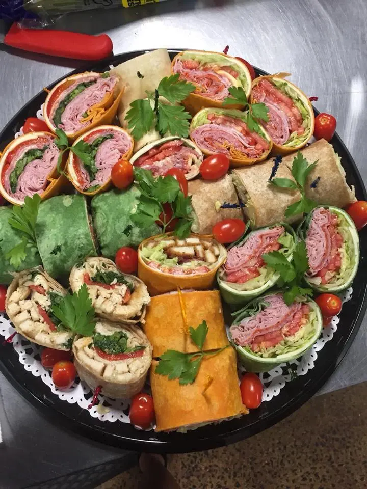 A catering platter of sandwich wraps and roll-ups