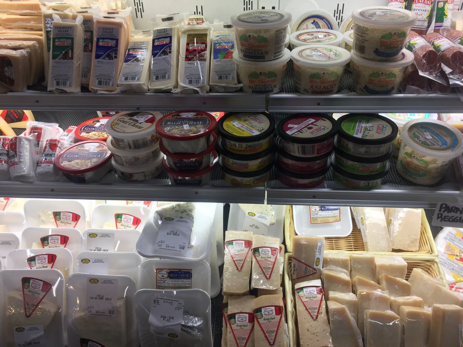 Wedges and wheels in the cheese case