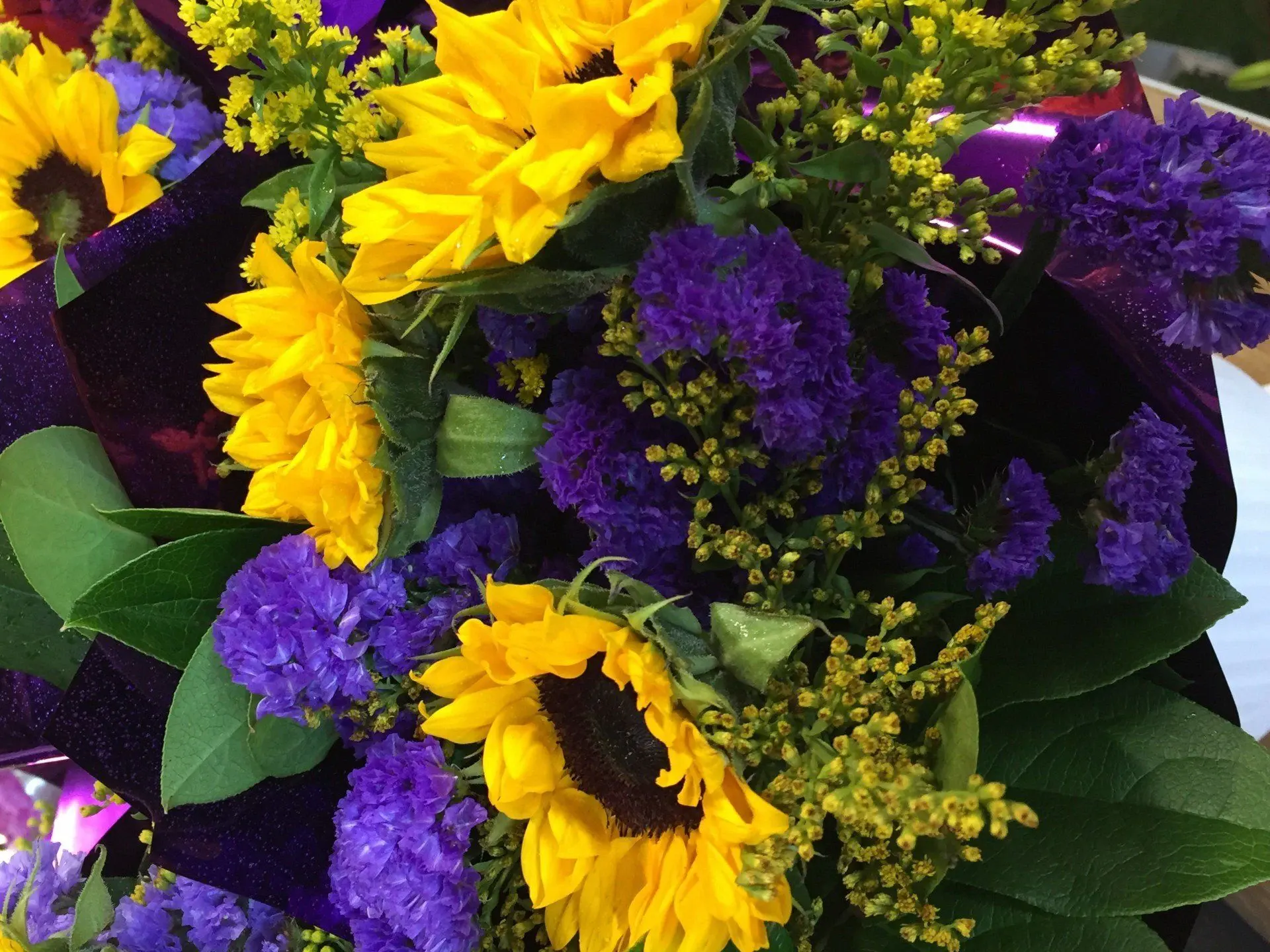 A mixed bouquet with sunflowers and irises