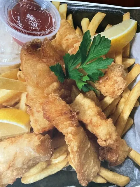 Fresh crunchy chicken tenders with fries