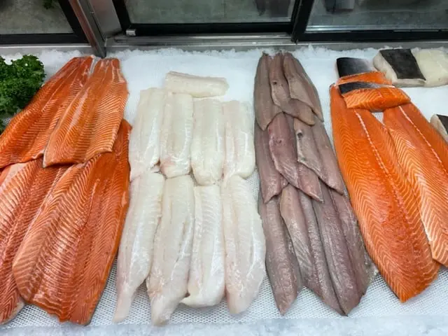 Fish fillets on ice in the seafood case