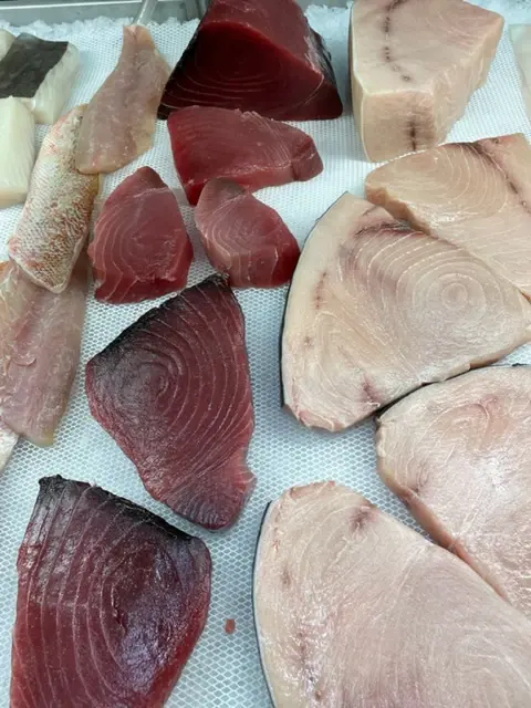 Tuna steaks in the seafood case