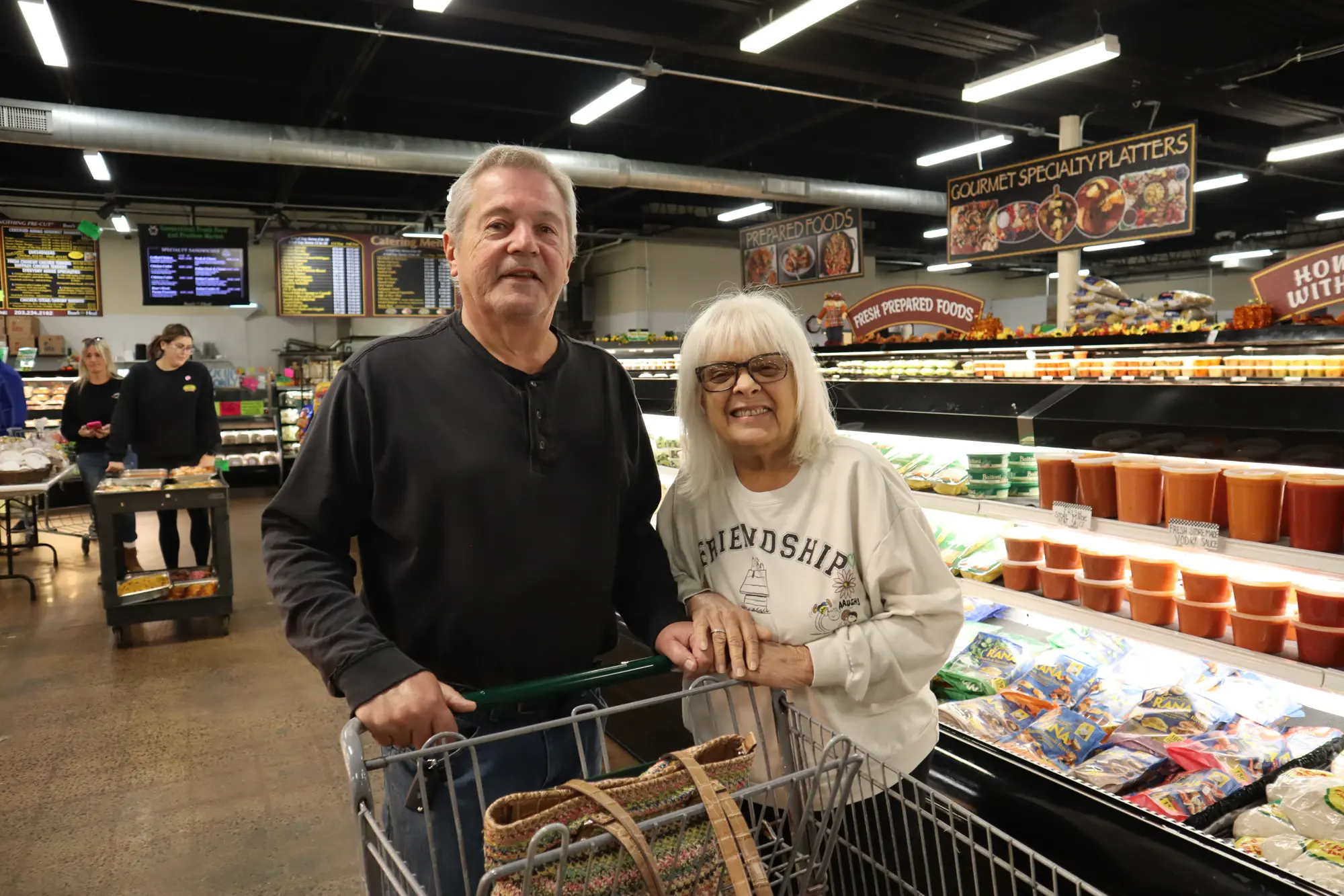 A couple shopping the market aisles
