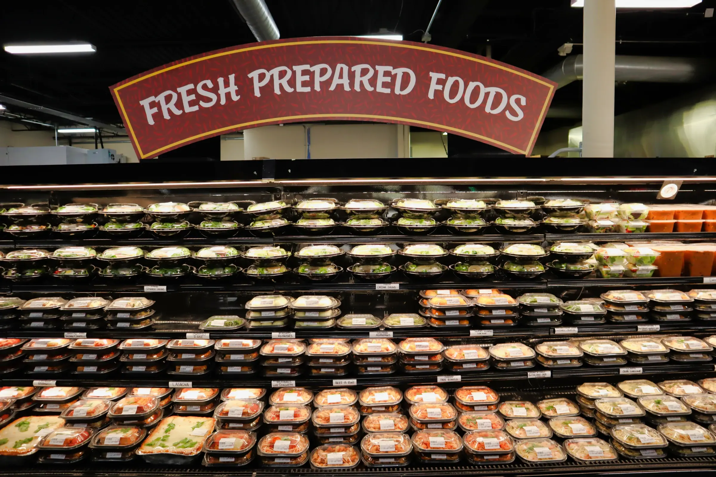 The Fresh Prepared Foods case stocked from top to bottom with house-made meals